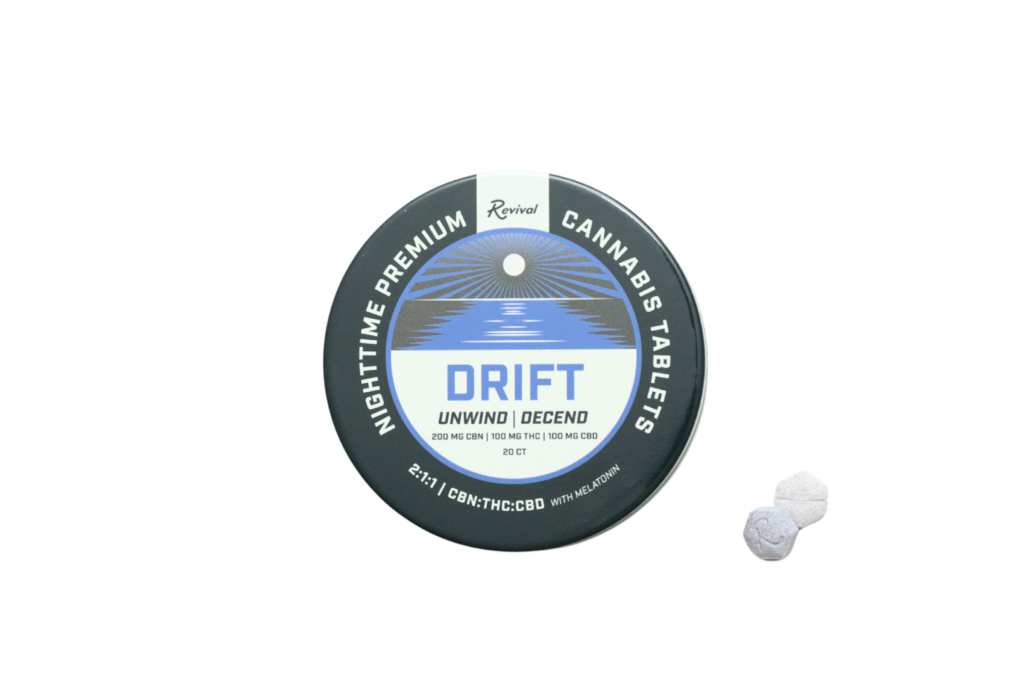 Revival Gems ‘Drift’ cannabis tablets tin with two lavender-colored hexagon tablets — formulated with CBN, THC, CBD, and melatonin to promote deep sleep and relaxation. A nighttime, full-spectrum product designed for restful, restorative effects.