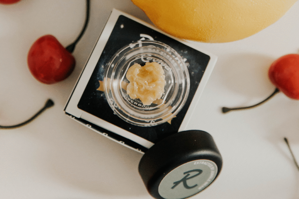 Superboof live hash rosin from Revival Farm Lab Market displayed with citrus and cherry, highlighting the strain’s terpene-rich flavor profile